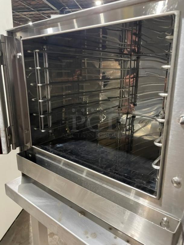 Groen Hyper Steam Series stainless steel electric convection steamer, model HY-3E. Features built-in pan racks, open base stand, 208V 3 phase, on legs. Serial number 3E28241MS.