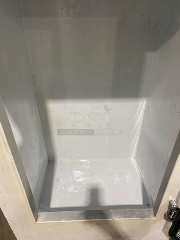 Leer commercial freezer model 301UC25MG, white interior. Single glass swing door. Indoor use. 115V. Visible wear.