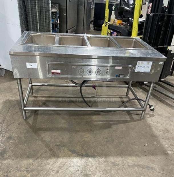 Wells stainless steel electric top-mount 4-well hot food steamtable, model MOD400TDM, on legs, 208/240V, used condition.