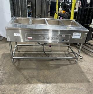 Wells stainless steel electric top-mount 4-well hot food steamtable, model MOD400TDM, on legs, 208/240V, used condition.