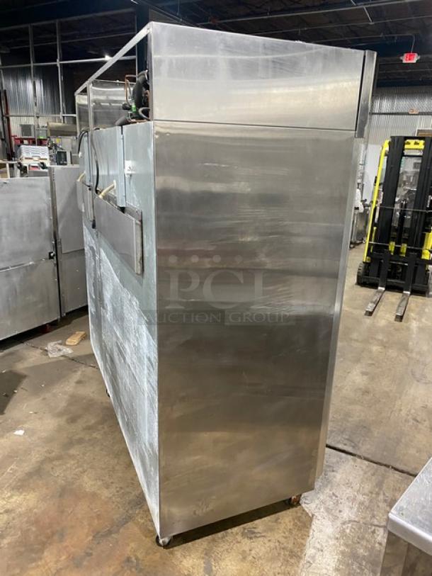 Hoshizaki commercial stainless steel refrigerator, model CR3SFGYCR, triple glass doors, on casters, side view.