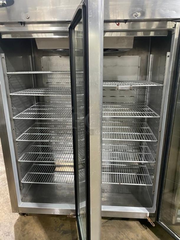 Hoshizaki CR3S-FGYCR commercial stainless steel triple glass door refrigerator, with poly-coated wire racks, on casters.