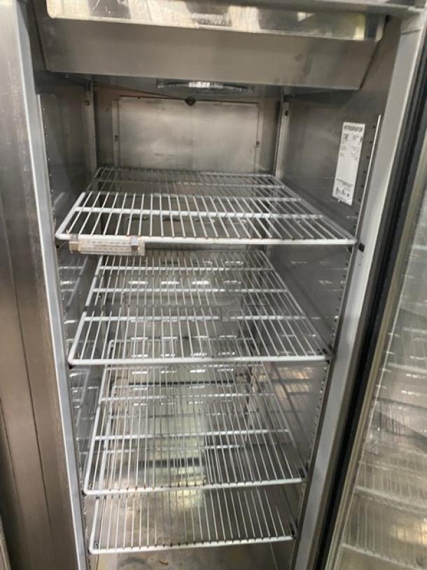 Hoshizaki CR3SFGYCR commercial stainless steel refrigerator, triple glass swing doors, poly-coated wire racks, on casters.