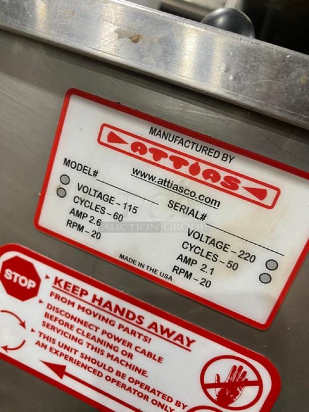 Stainless steel Attias automatic falafel maker, countertop model. Voltage: 115/220V. Visible label with model, serial, and safety info.