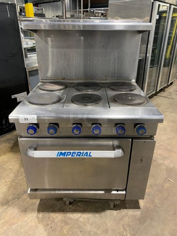 Imperial stainless steel 6-burner electric range with oven, backsplash, and overhead salamander shelf. Includes wired oven rack.