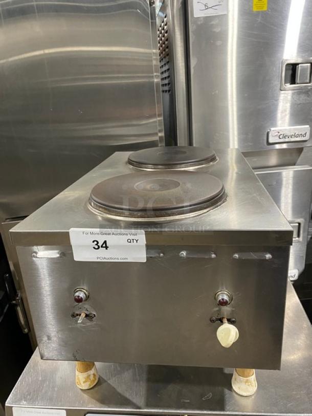 Commercial stainless steel electric countertop dual burner hot plate with legs, auction tag visible, excellent condition.