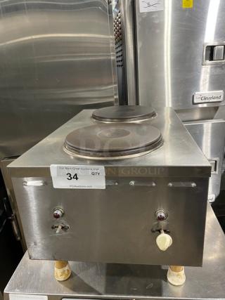 Commercial stainless steel electric countertop dual burner hot plate with legs, auction tag visible, excellent condition.