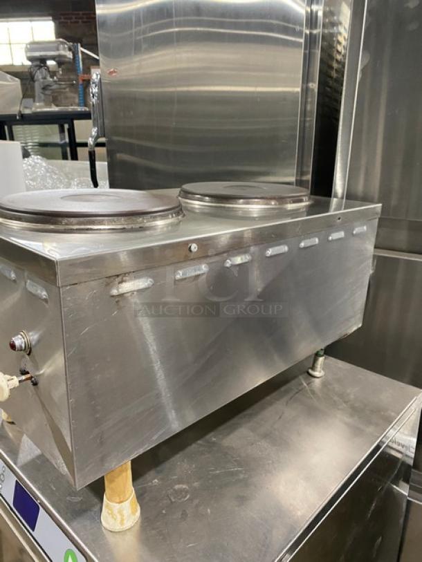 Commercial stainless steel electric countertop dual 2-burner hot plate on legs, showing front-to-back design. Used condition.