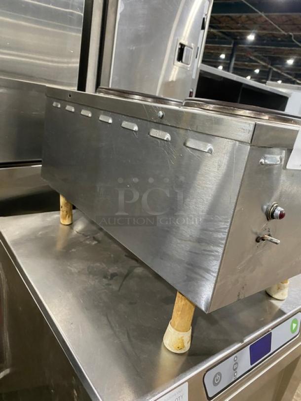 Commercial stainless steel electric dual burner hot plate on legs, featuring front-to-back design.