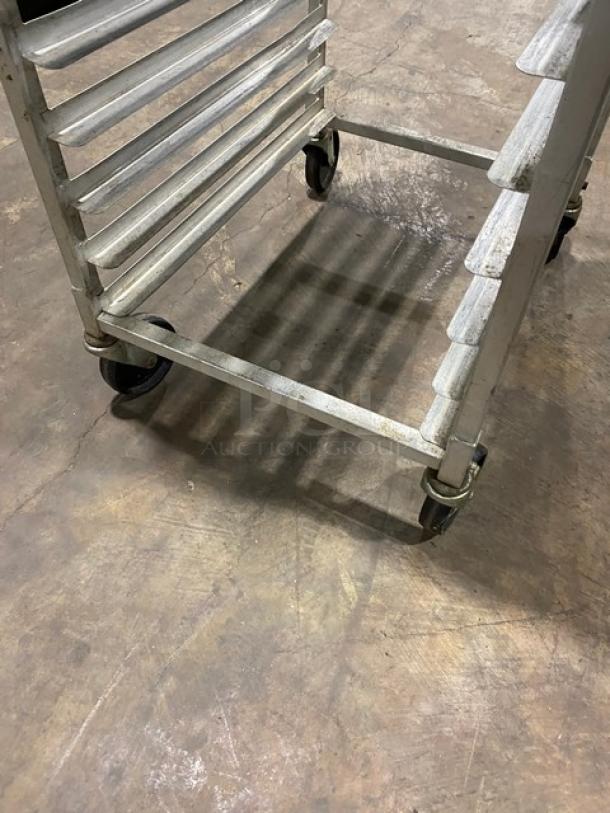 Winco ALRK-20 aluminum 20-pan rack with casters, sturdy condition, end-load design for sheet pans.