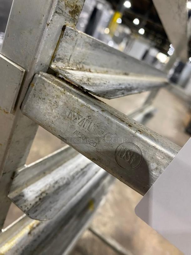 Winco ALRK-20 aluminum 20-pan sheet rack on casters, showing model and NSF marking. Visible scuffs indicate used condition.