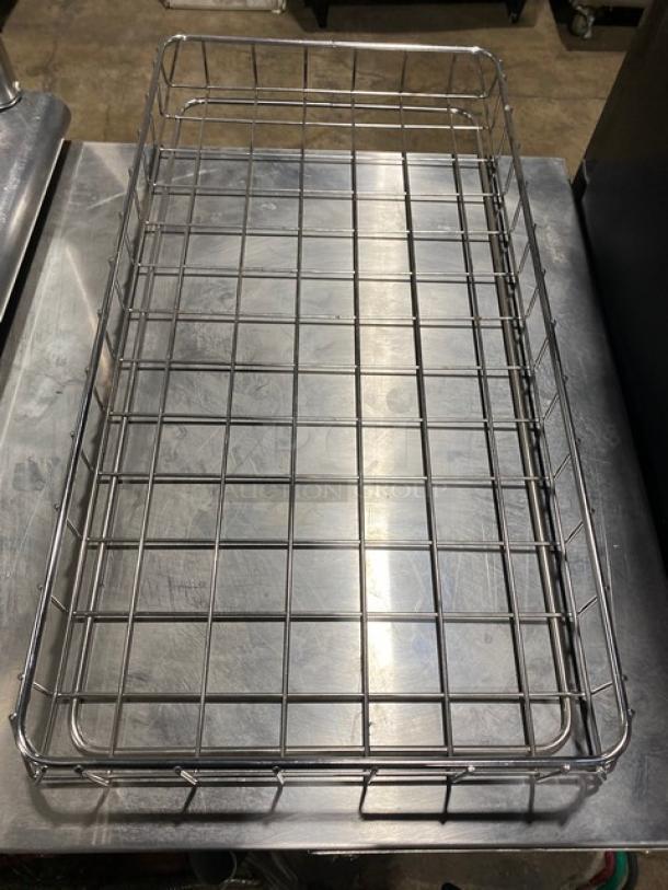 Chrome plated full-sized bagel/pastry wire rack. Features durable grid design. Excellent condition, ideal for commercial use.