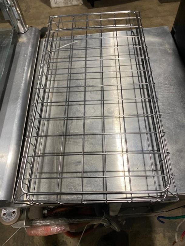 Commercial chrome-plated full-sized bagel/pastry wired rack, excellent condition, sturdy construction for bakery use.