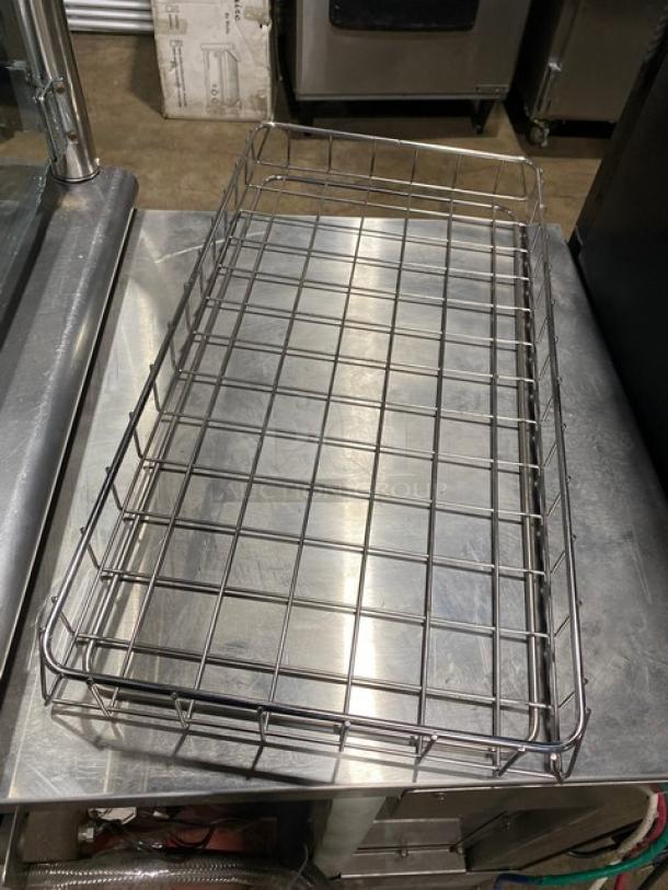 Commercial chrome-plated full-sized bagel/pastry wired rack in excellent condition, ideal for bakery display or storage.