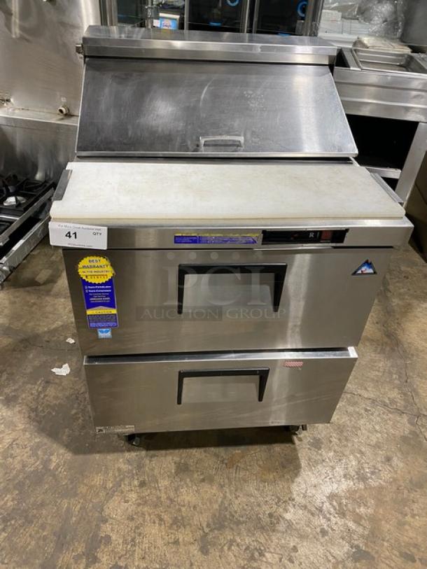 Everest stainless steel refrigerated prep table with 2 drawers and cutting board, bain marie style, on casters.