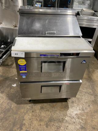 Everest stainless steel refrigerated prep table with 2 drawers and cutting board, bain marie style, on casters.