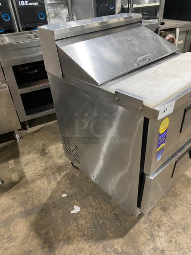 Everest stainless steel 2-drawer refrigerated bain marie prep table with cutting board. Features casters for mobility.