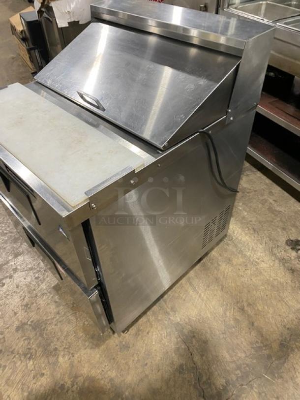 Everest stainless steel 2-drawer refrigerated prep table with cutting board, bain marie style, on casters, in good condition.
