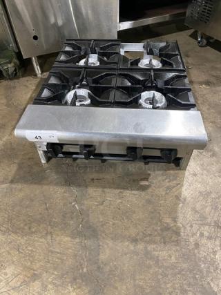American Range stainless steel natural gas 4-burner countertop range in good condition. Robust design, ideal for commercial use.