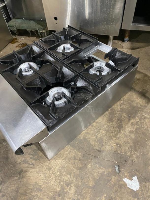 American Range commercial stainless steel 4-burner countertop range, natural gas-powered, in used condition.