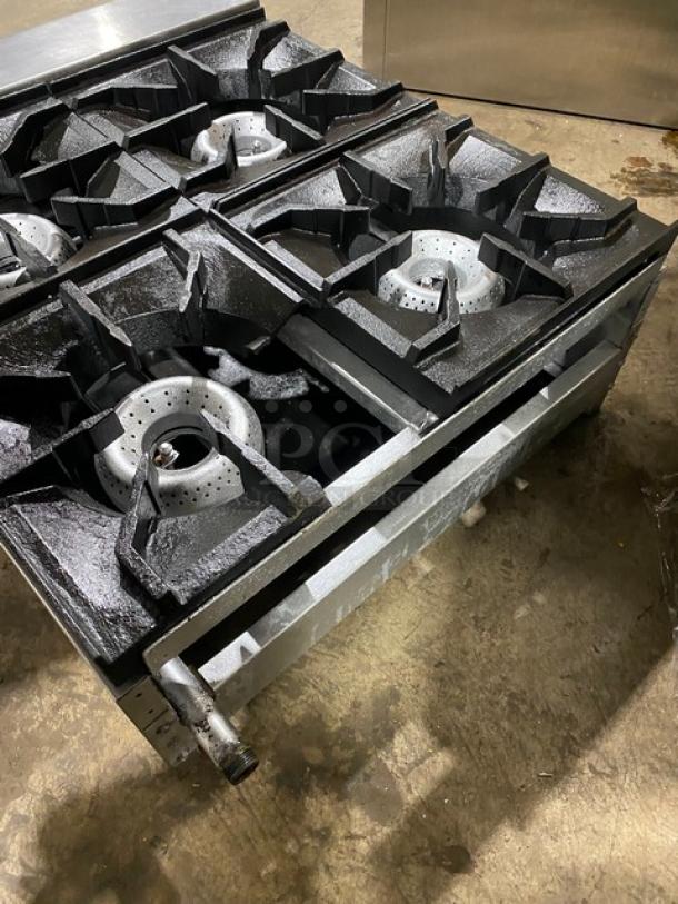 American Range stainless steel natural gas 4-burner countertop range, commercial use, robust condition.