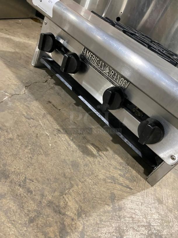 American Range Commercial Stainless Steel 4 Burner Natural Gas Countertop Range. Good condition with brand label visible.