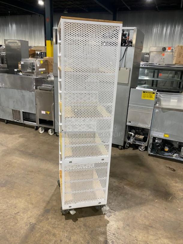 Commercial white 4-tier utility cart with wooden-style shelves, built-in pan slides, on casters, excellent condition.