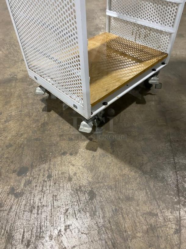 Commercial white 4-tier utility cart with built-in pan slides, wooden style shelves, and casters for mobility.
