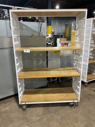 Commercial white 3-tier utility cart with built-in pan slides, wooden-style shelves, and caster wheels.