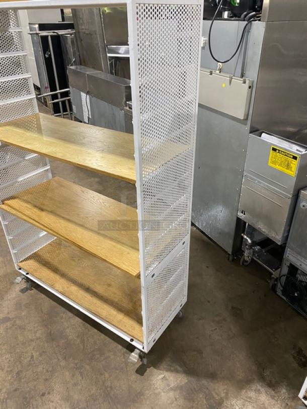 Commercial 3-tier utility cart with white frame, wooden-style shelves, built-in pan slides, and casters. Ideal for kitchen use.