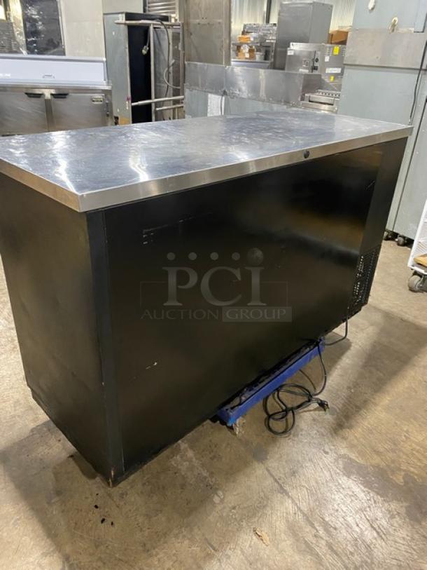 True Commercial Black Double Glass Sliding Door Back Bar Cooler, Model TBB-24-60G-SD, with stainless steel worktop.
