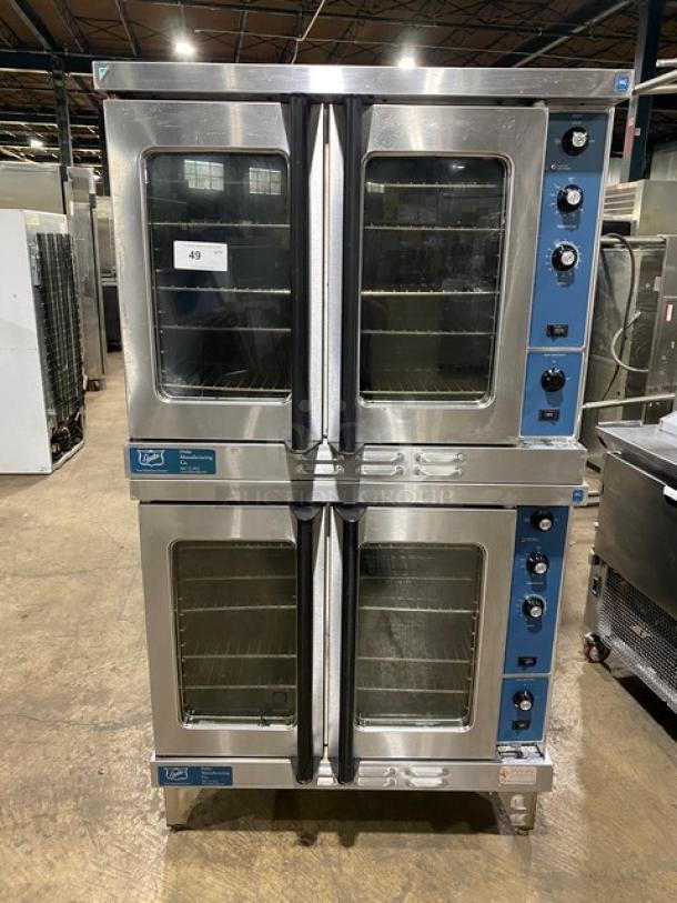 Duke commercial double-stacked convection oven, stainless steel, Model E101GV, thermostatic controls, wired racks, on legs.