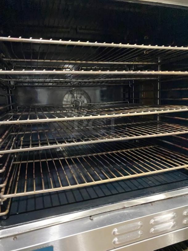 Duke E101GV stainless steel natural gas convection oven, double stacked, with thermostatic controls and wired racks.