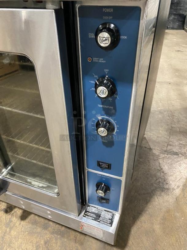 Duke E101GV double stacked convection oven, stainless steel, natural gas, thermostatic controls, wired racks, on legs.