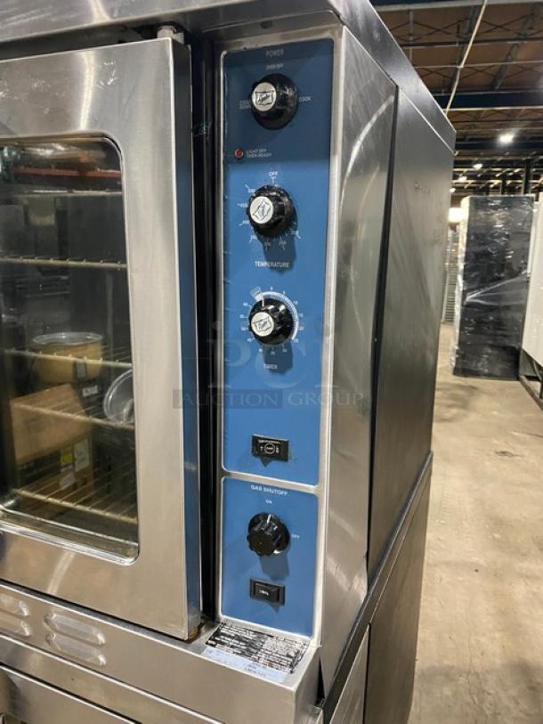 Duke E101GV stainless steel double-stacked convection oven, natural gas, thermostatic controls, wired racks, on legs.