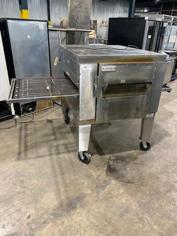 Lincoln Impinger 1400 Series stainless steel conveyor oven, natural gas, Model 1450-000-U-K1801, on casters, used condition.