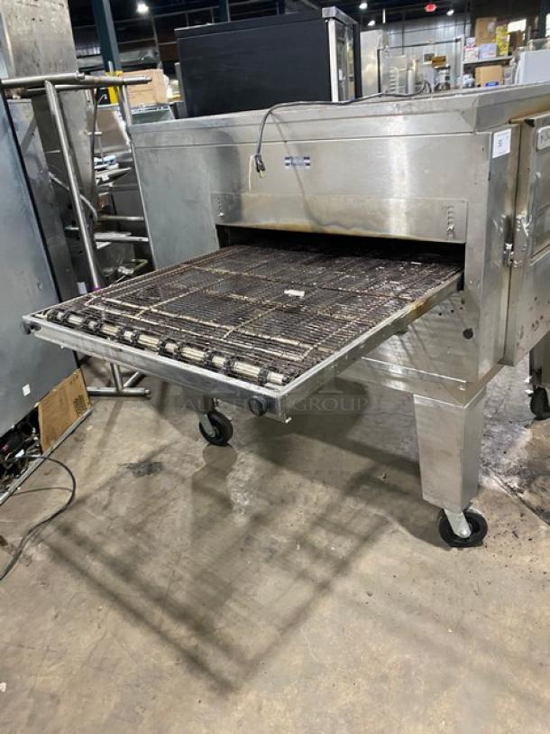 Lincoln Impinger 1400 series stainless steel conveyor oven, model 1450-000-U-K1801, natural gas, on casters, 120V, used condition.