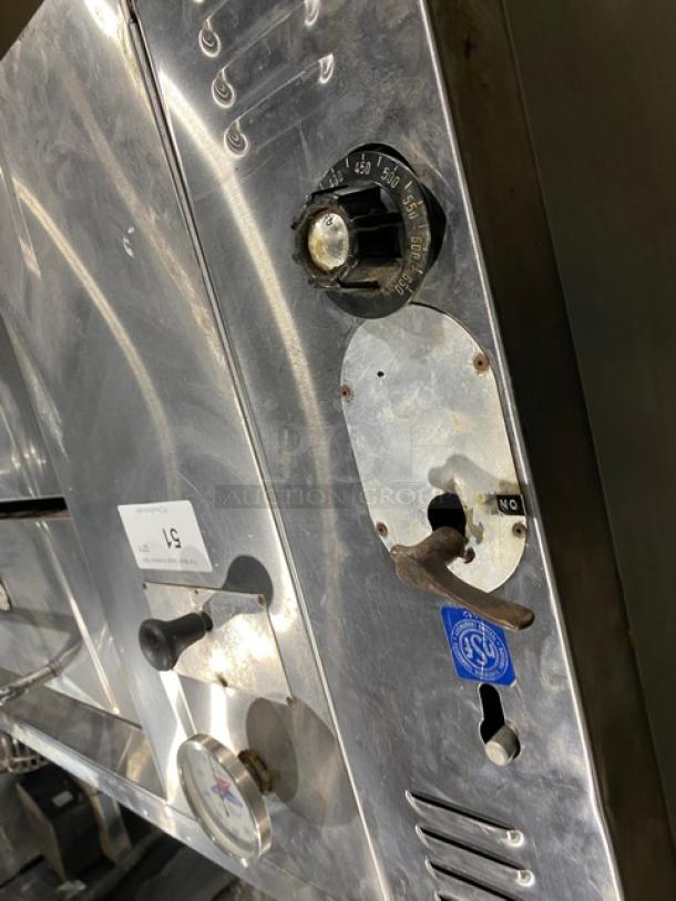 Bakers Pride commercial stainless steel gas pizza deck oven with thermostatic control, visible knobs and dials.