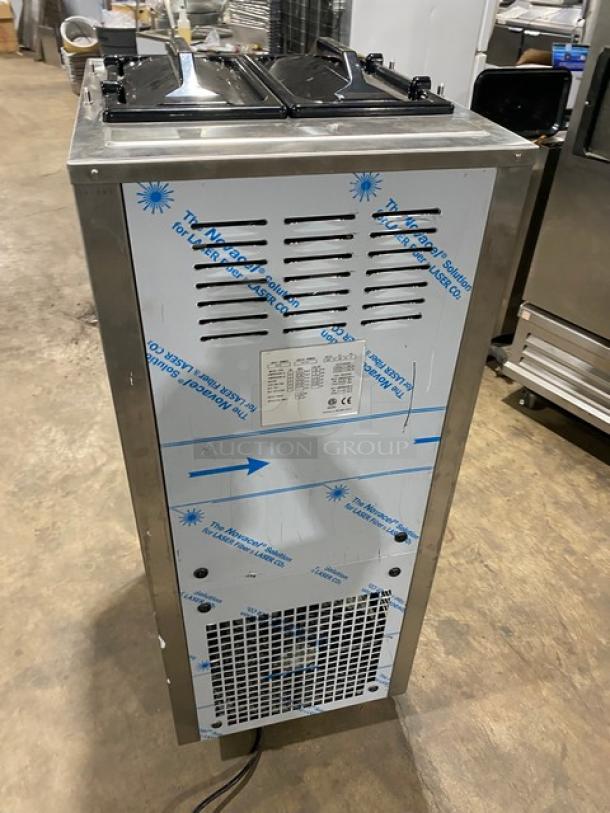 Ineo 6240 stainless steel soft serve machine, dual flavor with twist, 2 hoppers, new condition, on casters. 220V 3-phase.