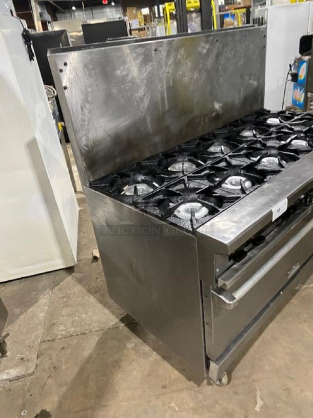Therma Tek stainless steel 10-burner range with double oven, back splash, wired racks, on casters. Natural gas powered.