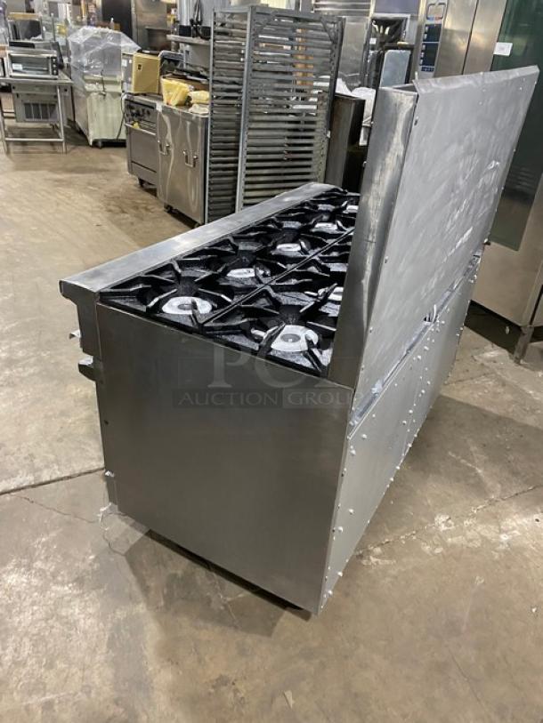Therma Tek commercial stainless steel 10-burner range with double oven, backsplash, wired racks, on casters, natural gas powered.