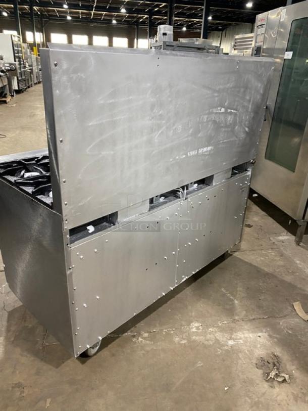 Therma Tek stainless steel 10-burner range/double oven with backsplash and wired racks on casters, natural gas powered.