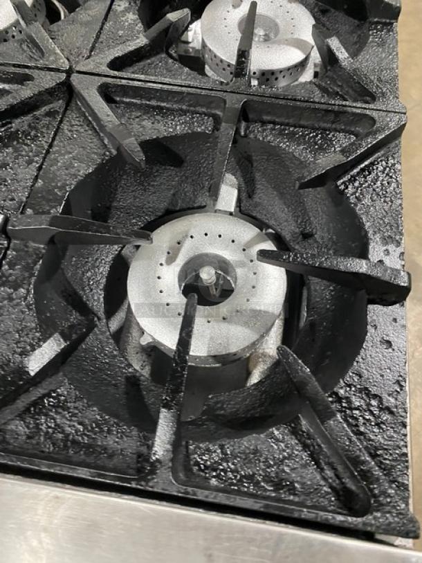 Therma Tek commercial stainless steel 10-burner range, natural gas, featuring durable cast iron grates, in used condition.