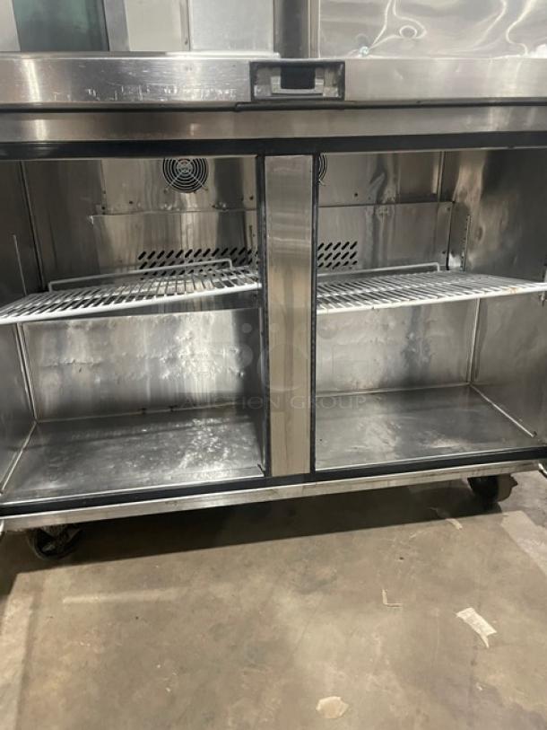 Migali 2016 commercial undercounter refrigerator, model C-U48R, stainless steel, poly coated wire racks, on casters.