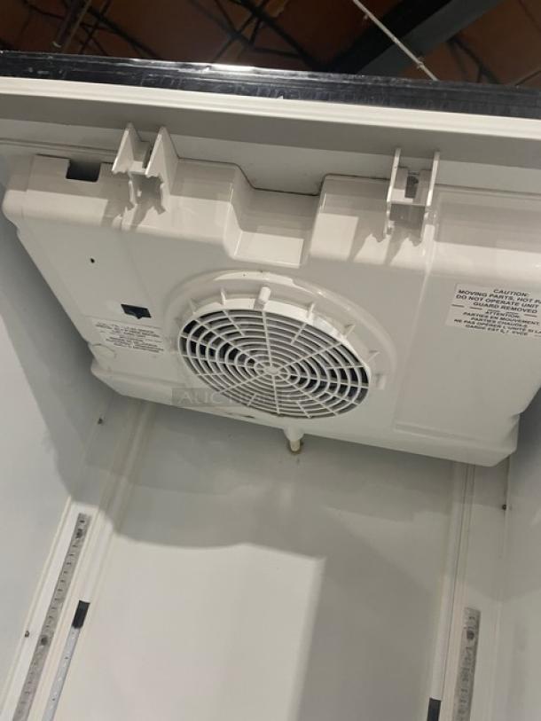 Imbera G319C02 refrigerator interior with fan, white casing, labeled panel showing caution and model info, 115V, 1 Phase.