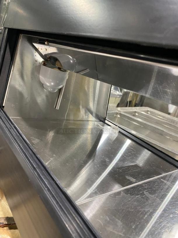 Turbo Air black refrigerated countertop sushi merchandiser with stainless steel interior and rear sliding doors. SN: H2SAS50D1024.