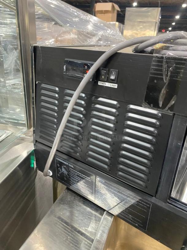 Turbo Air black refrigerated countertop sushi display with stainless steel interior, rear sliding doors, SN: H2SAS50D1024.