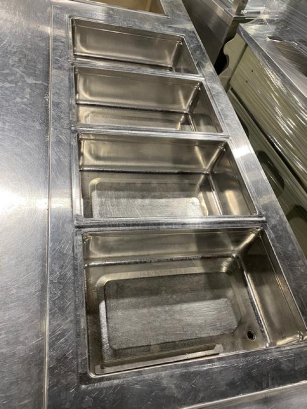Delfield LiquiTec Series 4-Pan Cold Food Well, stainless steel, model 8159EFP. Includes Wells single-pan hot food well, model MOD100TD.
