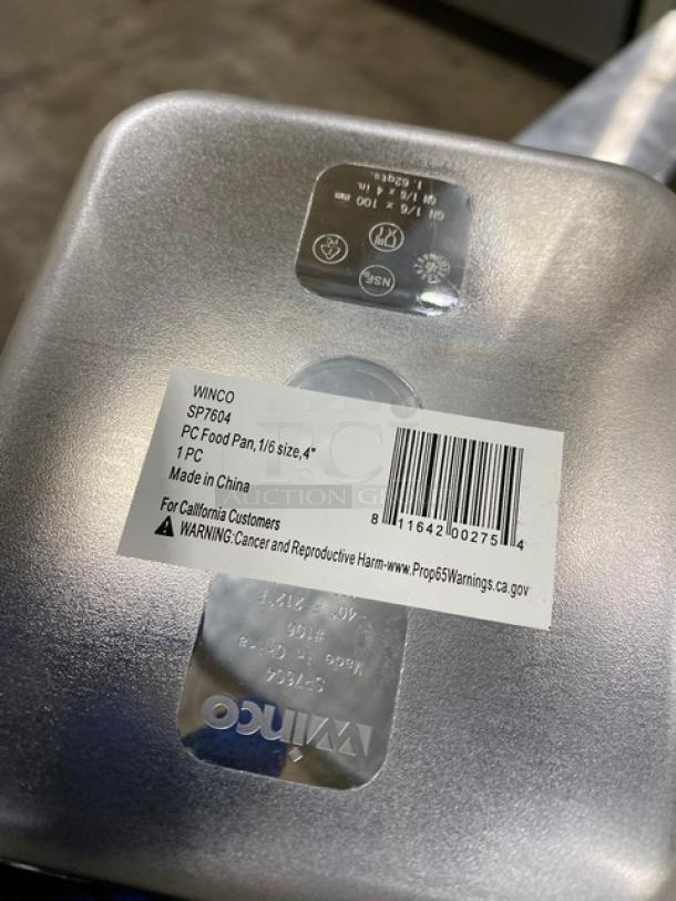 Winco SP7604 1/6-size clear polycarbonate food pan, 4" deep, new condition, label indicates model and safety warning.