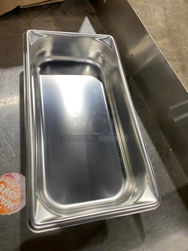 NEW Vollrath SuperPan V Series Stainless Steel 1/3-Size 2.5" Deep Hotel Pan, Model 30322, shiny finish.